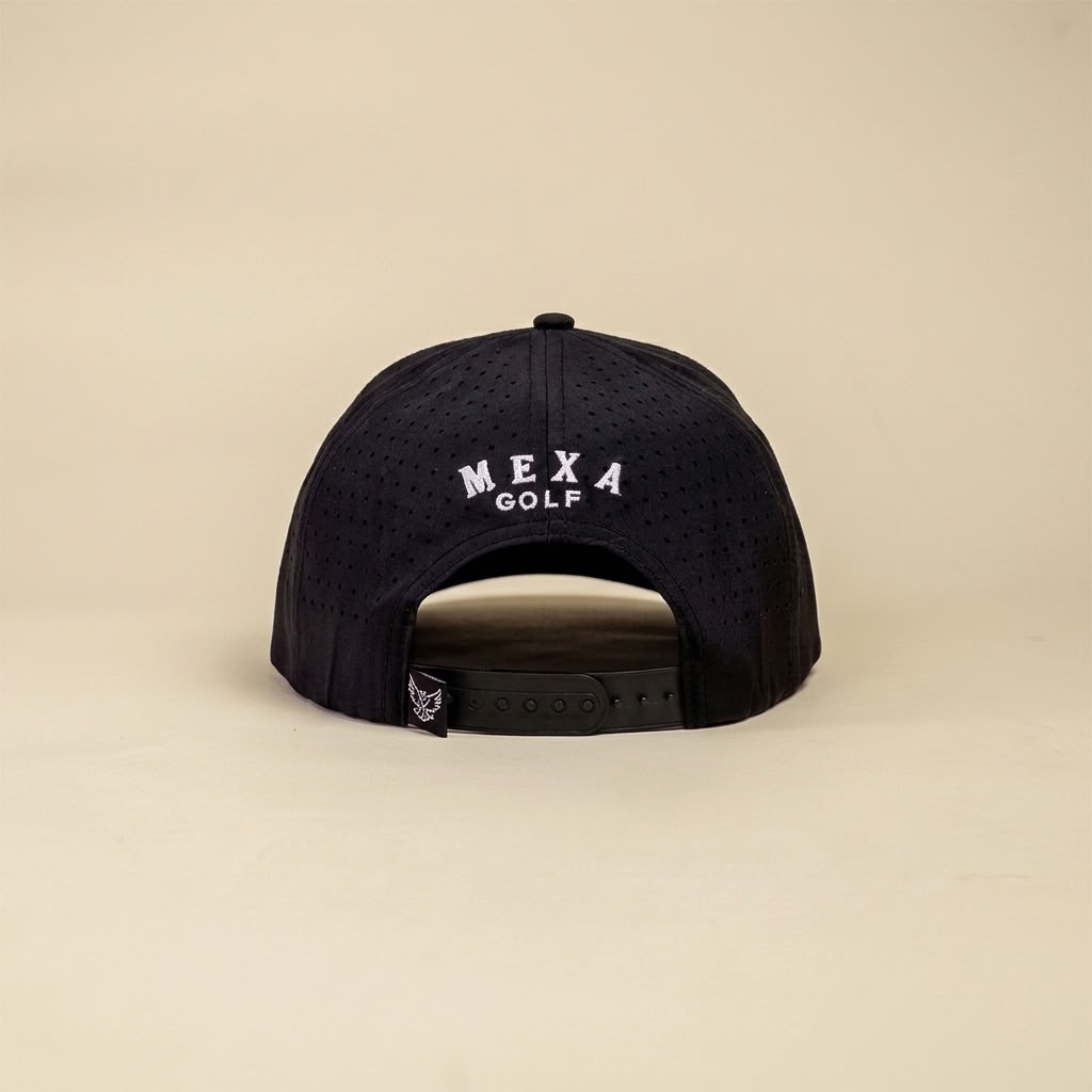 A black perforated snapback cap shown from the back, featuring 'MEXA GOLF' embroidered in white on the crown, set against a solid beige background.